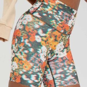 Orange and Green Bike Shorts with Vibrant Floral Print